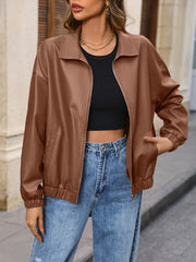 Brown faux leather bomber jacket with zip front and elastic cuffs