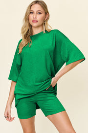 Textured boxy tee and shorts set in mid green, casual outfit with crew neck and short sleeves.