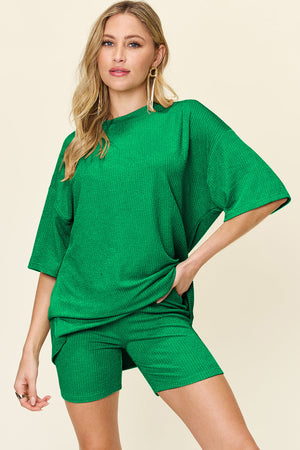 Textured boxy tee and shorts set in mid green, casual outfit with crew neck and short sleeves.