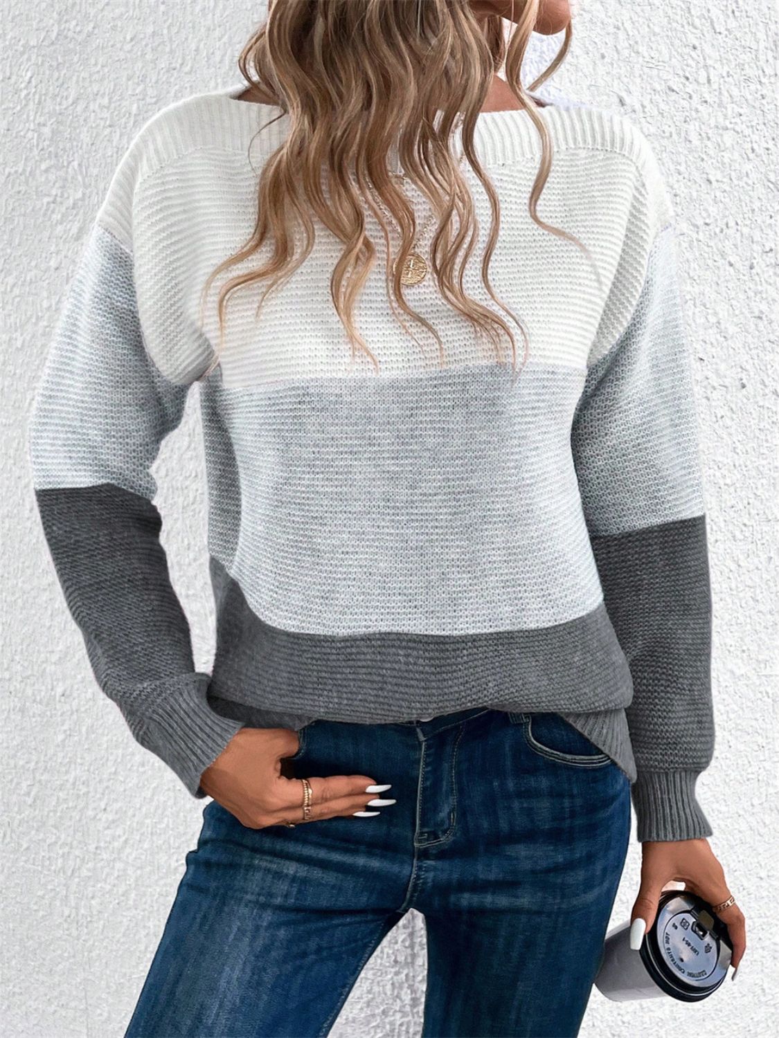 Colorblock boatneck knit sweater in white, light gray, and dark gray acrylic.