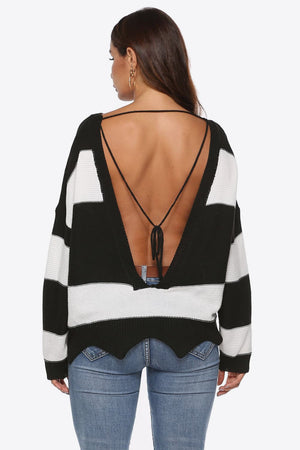 Open-back stripe knit sweater with frayed hem and tie detail.