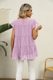 Pink lavender Swiss dot tiered blouse with flutter sleeves and button back detail.