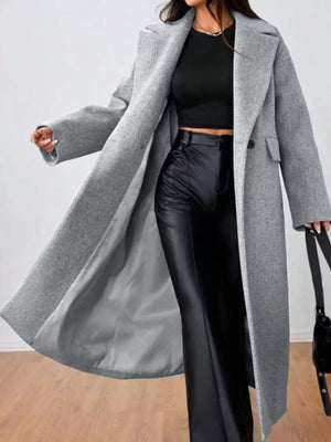 Gray wool-blend longline overcoat with notched lapels and button closure, worn open.