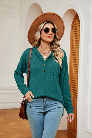 Textured green henley hoodie with drop shoulder and button neckline