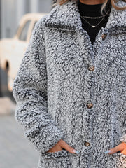 Teddy bear textured button-down coat in grey with brown buttons and pockets.