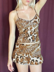 Leopard print cami and skirt set with lace trim and spaghetti straps.