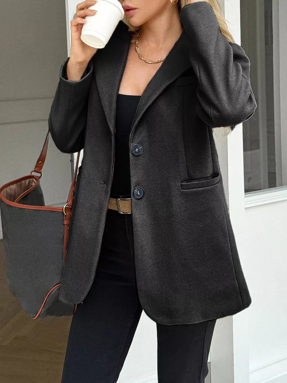 Chic gray lapel blazer with button closure and practical pockets.