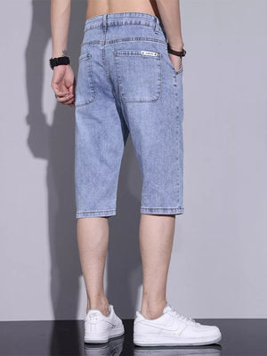 Light blue washed denim shorts for men with button closure and back pockets.