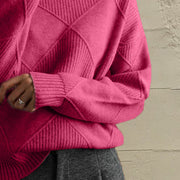 Hot Pink acrylic turtleneck sweater with diamond knit texture and ribbed cuffs.