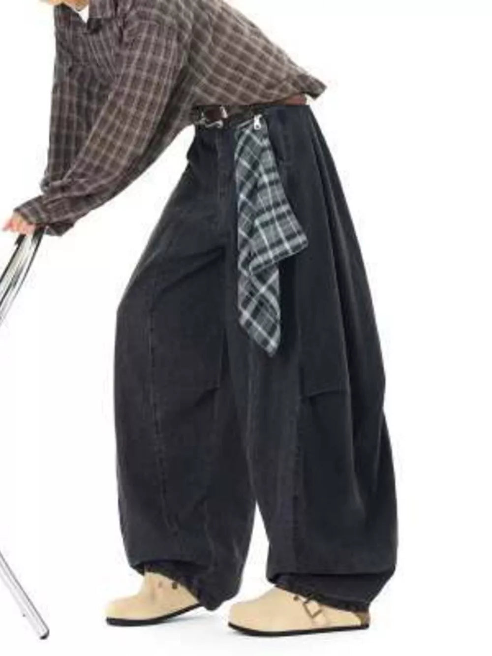 Belted wide-leg vintage wash jeans in dark denim with a plaid scarf detail.