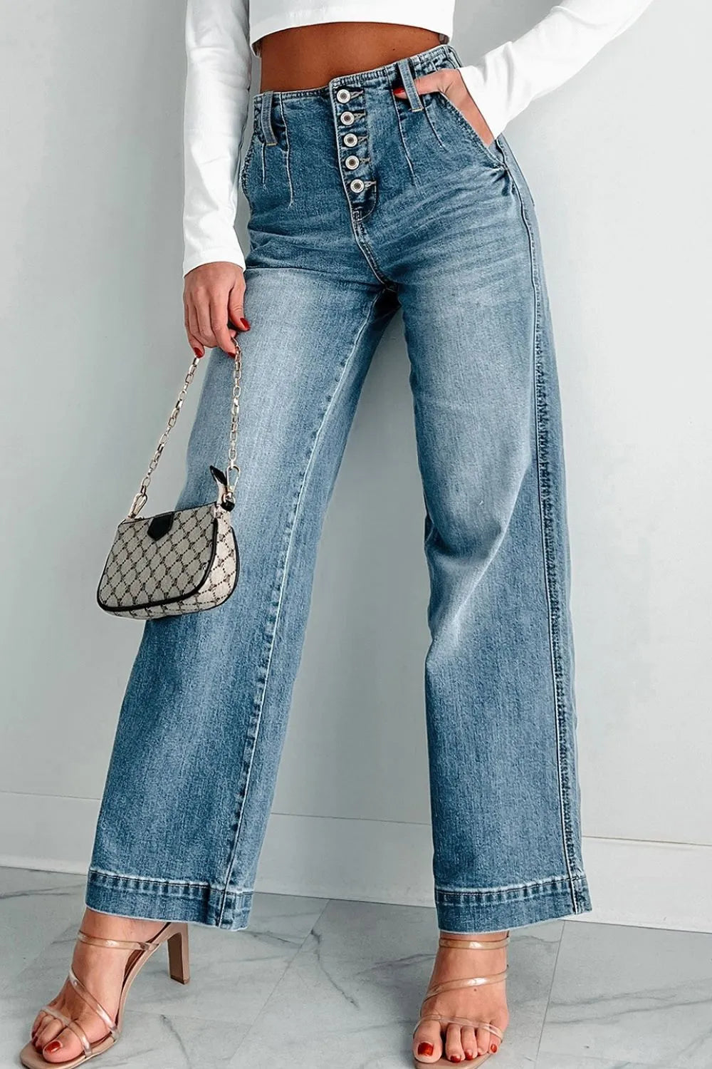 Button-fly wide-leg denim trousers in medium wash with a high waist.