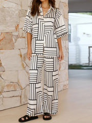 White geometric print resort co-ord set with buttoned short sleeve shirt and wide leg pants