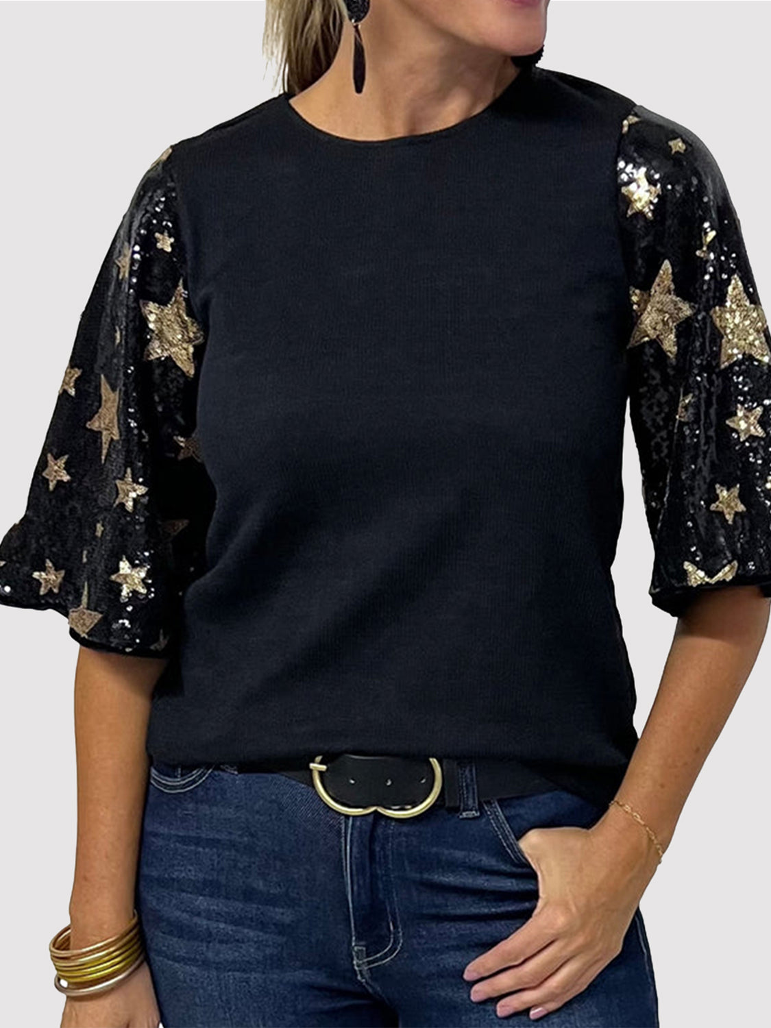 Black knit top with sequin star sleeves