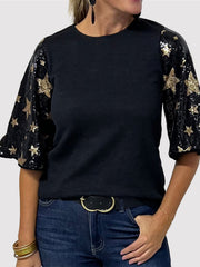 Black knit top with sequin star sleeves