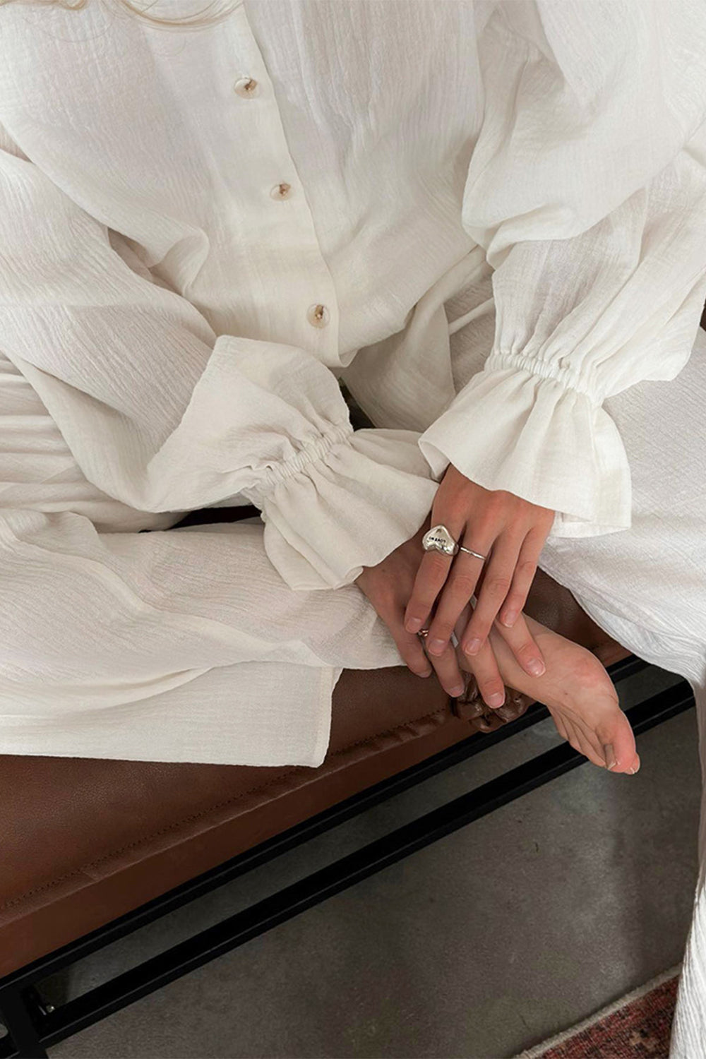 White gauze lounge set with voluminous ruffled sleeves and button front detail