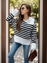 Breton stripe knit sweater with wide collar and long sleeves, styled with jeans.