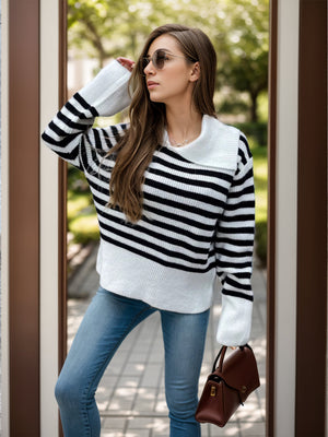 Breton stripe knit sweater with wide collar and long sleeves, styled with jeans.
