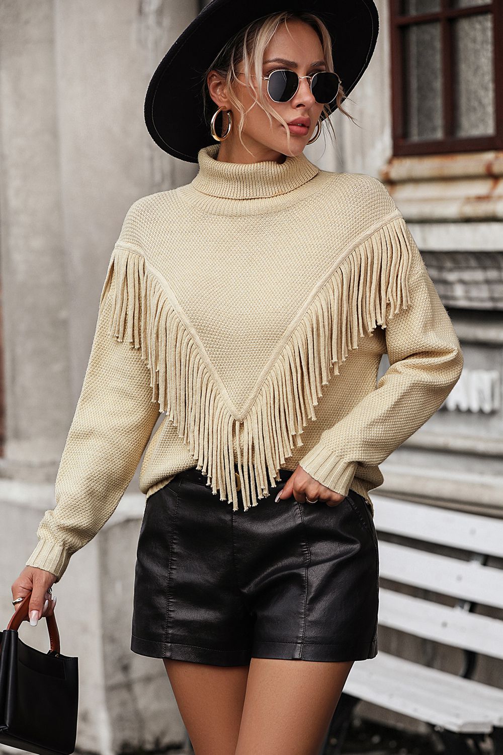 Beige turtleneck sweater with chevron fringe detail and long sleeves