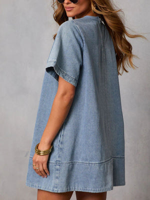 Light-wash denim A-line dress with crew neck and short sleeves, above knee length