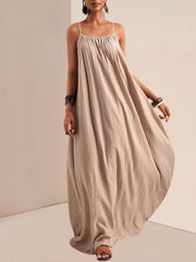 Khaki maxi dress with spaghetti straps and a gathered neckline, flowing A-line skirt.