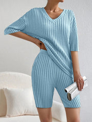 Light blue ribbed V-neck loungewear set with short sleeves and bike shorts.