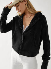 Black waffle knit cropped hoodie with snap front and hood.