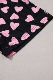 Black pajama shorts with pink heart print and pink trim detail
