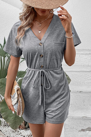 Gray Dawn button-front romper with short sleeves, V-neck, waist tie, and pocket.