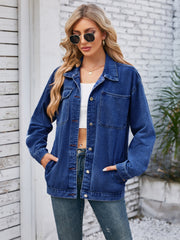 Dark blue oversized denim jacket with hood detail, buttoned front, and chest pockets.