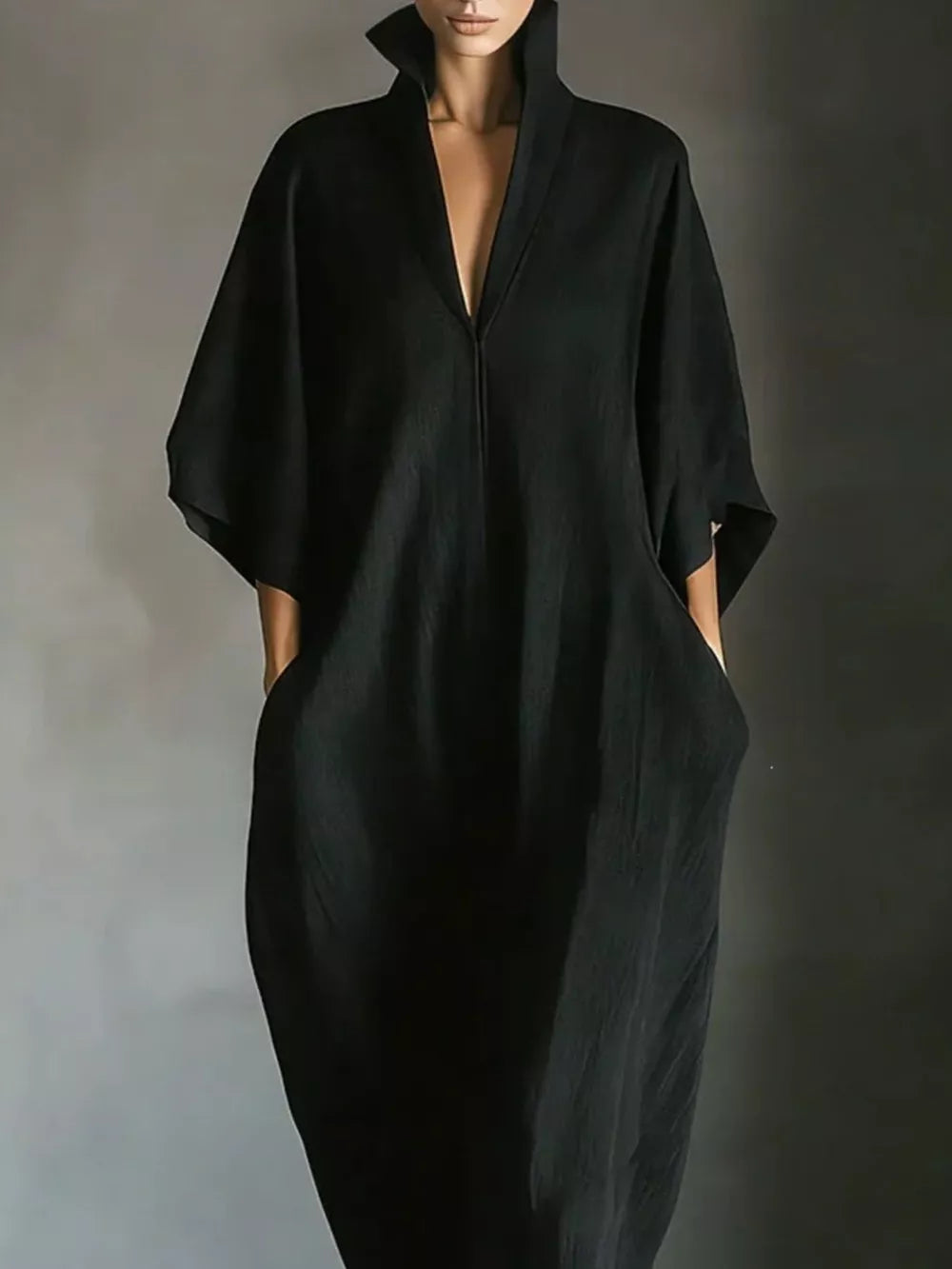 Black maxi dress with deep V-neck, wide sleeves, and pockets
