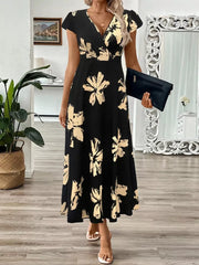 Black floral print midi dress with cap sleeves and a v-neckline.