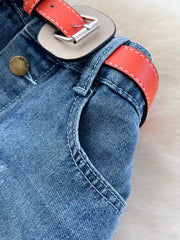 Denim midi skirt with red belt detail and button closure.