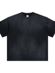 Oversized washed black t-shirt with relaxed fit and crew neck.