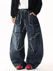 Star Patchwork Distressed Wide Leg Jeans in dark wash denim with frayed details.