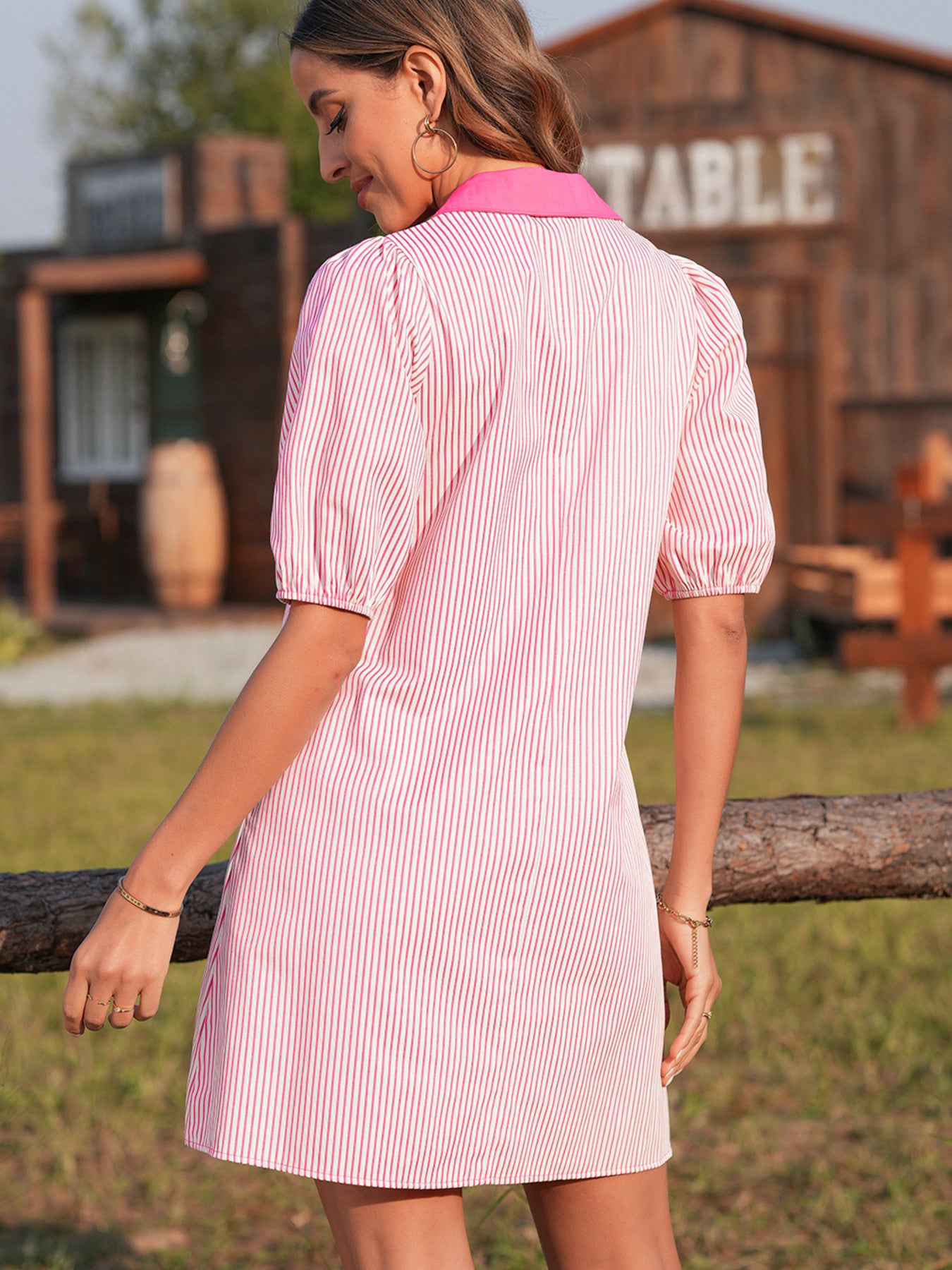 Button-down puff sleeve mini dress in pink and white stripe cotton with a contrast collar.