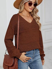 Brown diamond eyelet knit V-neck sweater with long sleeves.
