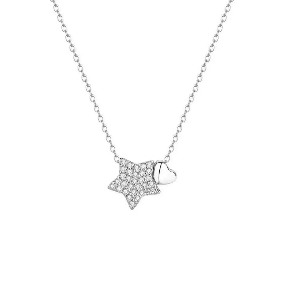 White gold necklace with a pave star and heart charm.