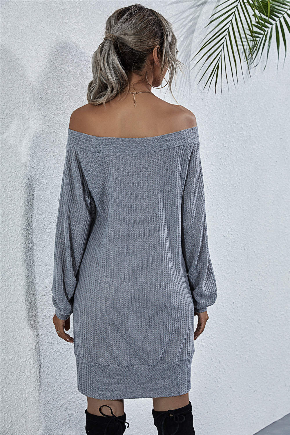 Off-shoulder waffle knit mini dress in dark gray with long sleeves and a relaxed fit.