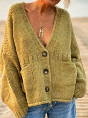 Textured bouclé oversized button-down cardigan in lime with patch pockets and a V-neck.