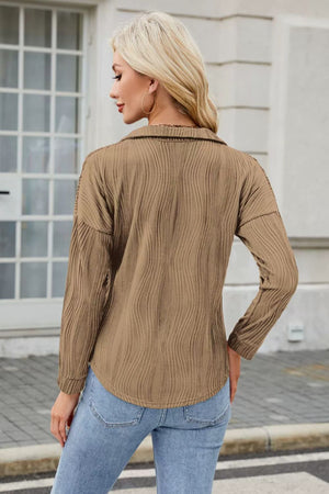 Taupe long sleeve collared blouse with wave-effect texture and curved hem