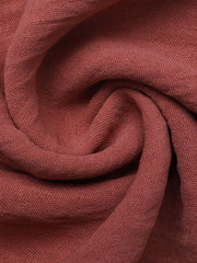 Plunging V-neck maxi dress fabric detail in dusty rose with a textured weave.