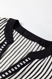 Chic black and white striped cotton midi dress with black trim and square detail.