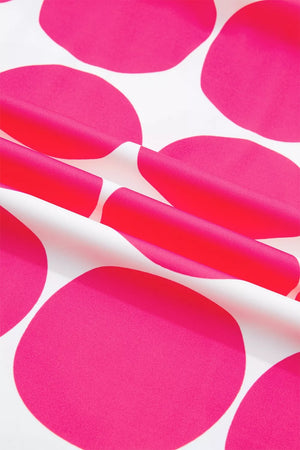 Polyester frill tank top with playful pink polka dots on white fabric.