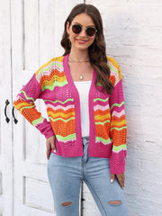 Crochet cardigan with rainbow wave pattern in pink, orange, yellow, and green acrylic.