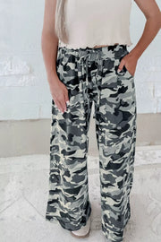 Casual camouflage drawstring waist pants with pockets and wide legs.