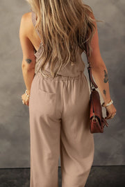 Waffle knit wide leg jumpsuit in khaki with back pockets and a drawstring waist.