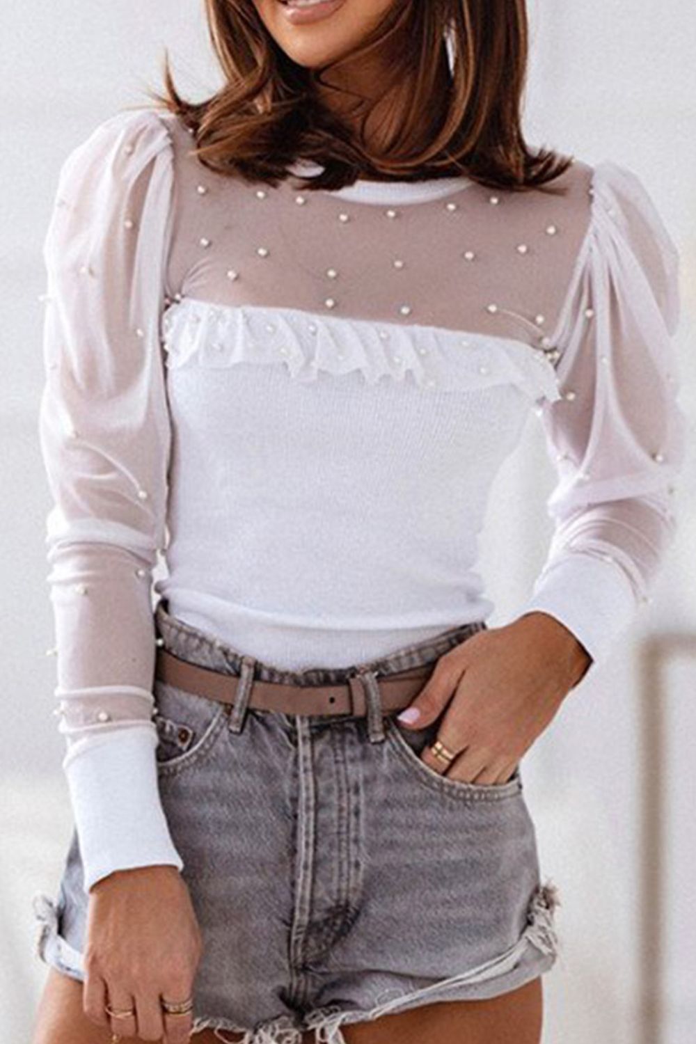White bodysuit with pearl-embellished sheer mesh yoke and puff sleeves