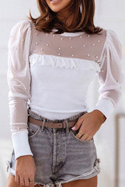 White bodysuit with pearl-embellished sheer mesh yoke and puff sleeves