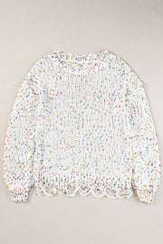 White confetti knit sweater with distressed hem and neckline.