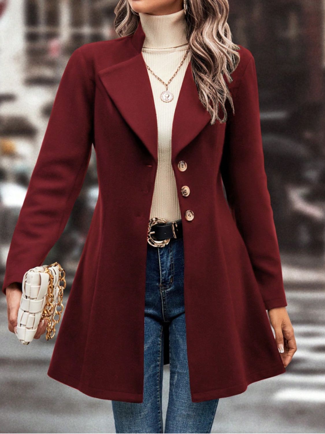 Burgundy wool blend coat with flared hemline, button closure, and notched lapels.
